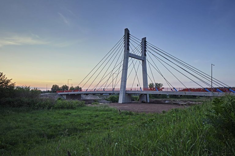 bridge-field-against-sky-sunset